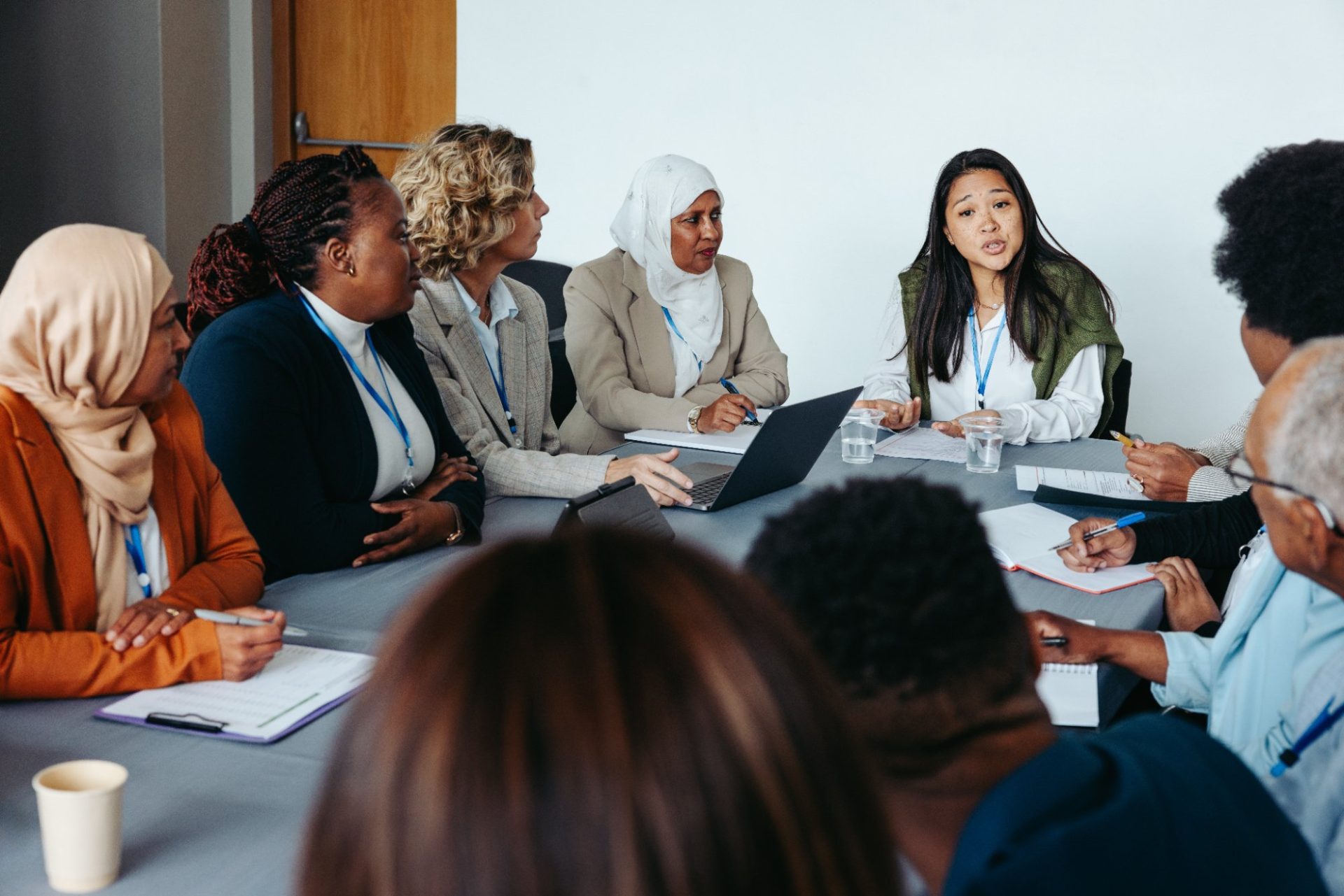 A diverse group in a round-table co-production discussion