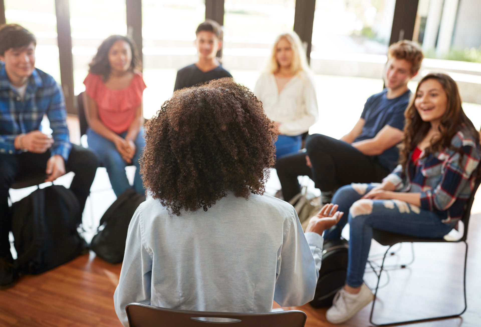 A facilitator leading a continuous engagement discussion group