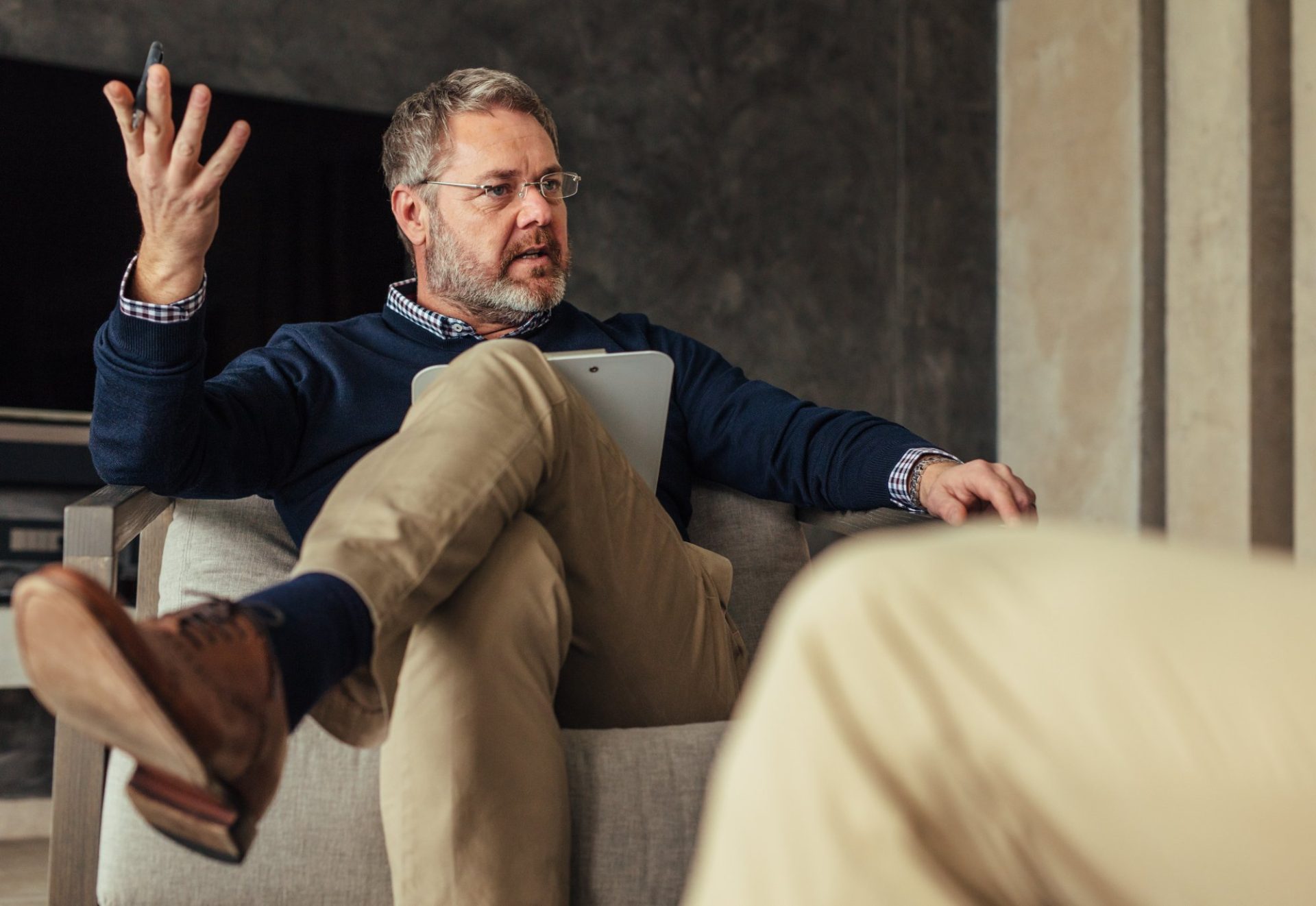 A consultation adviser gesturing while discussing options