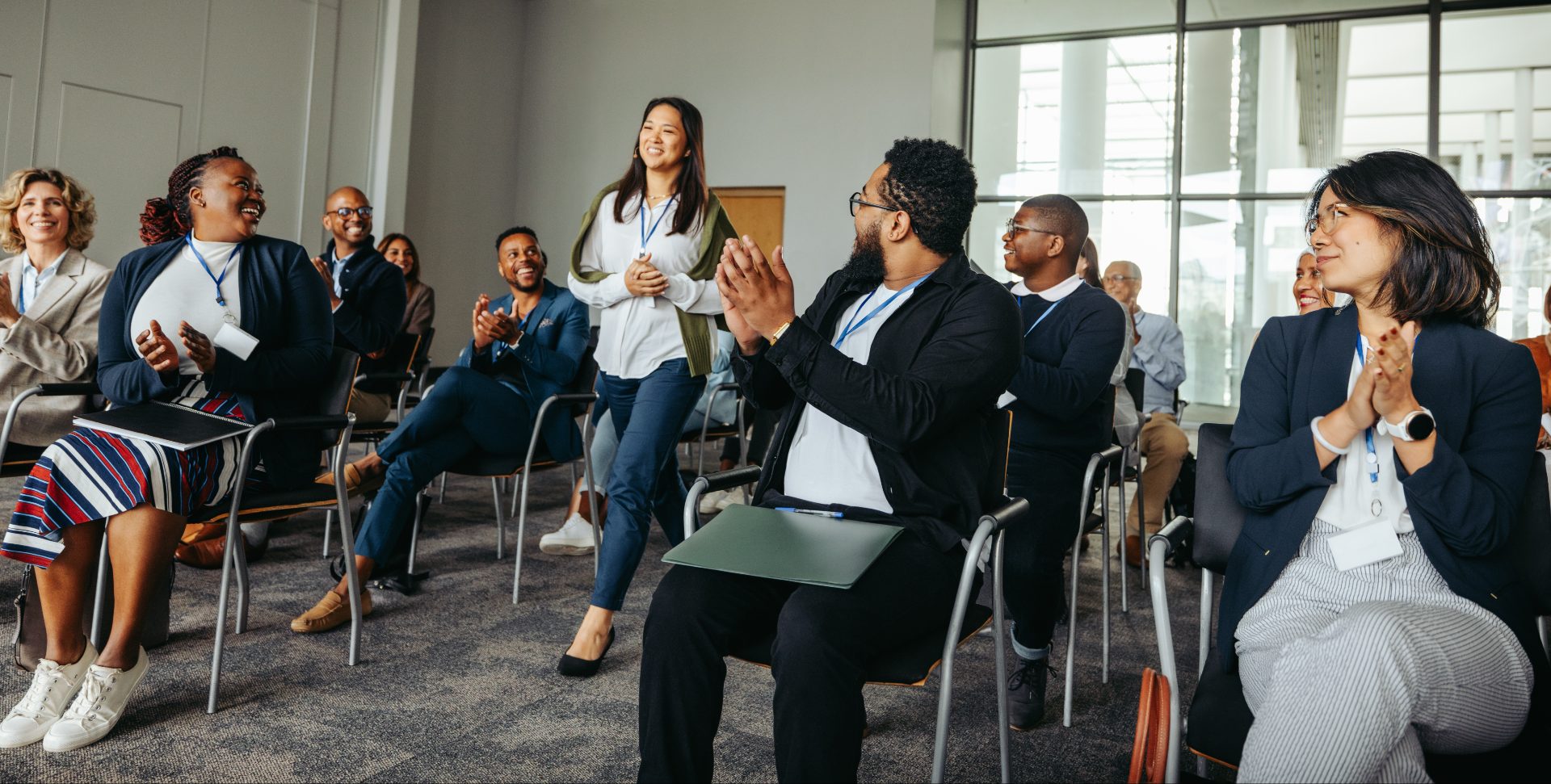 Delegates applauding at the end of a training session