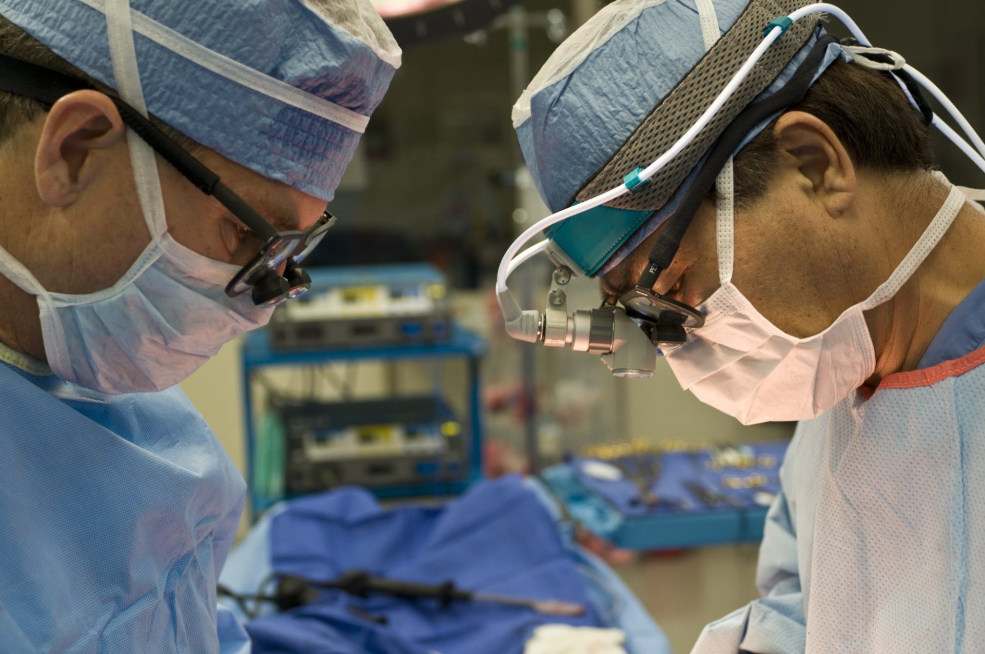 Two surgeons operating in an operating theatre
