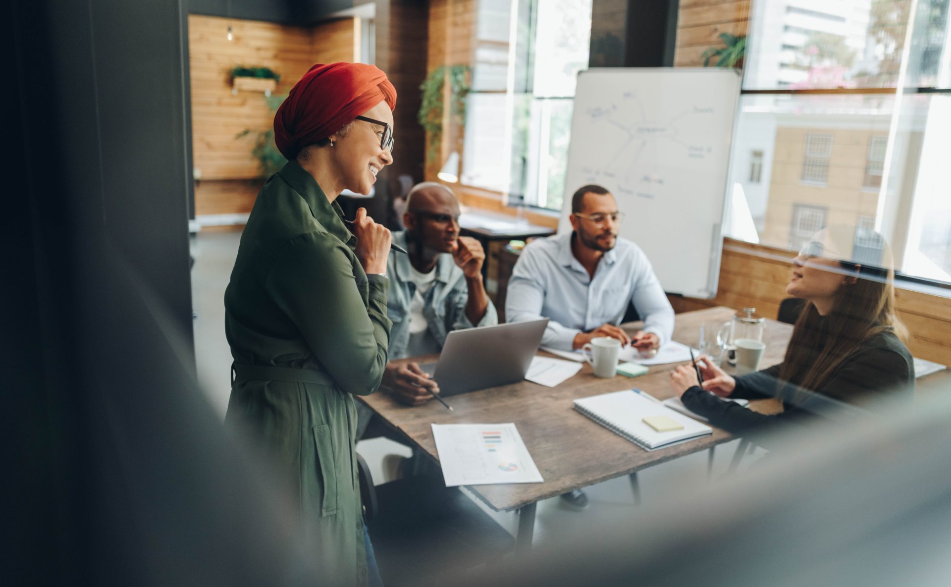 Consultation professionals in a working meeting, presenting around a table